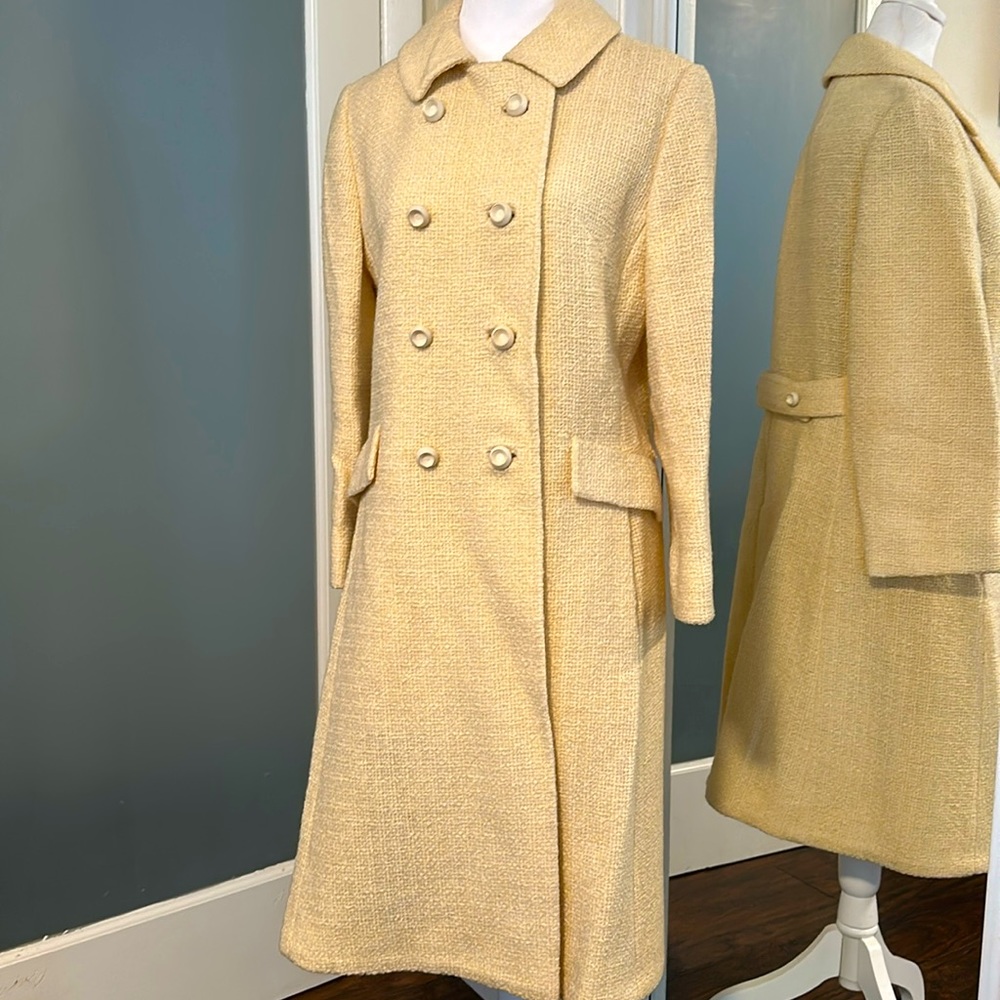 Vintage cream colored  overcoat. Double breasted look with white buttons
